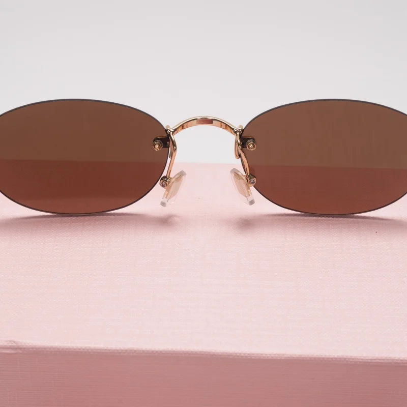 New frameless oval women's small glasses sunglasses brand designer fashionable luxury girls travel driving party sunglasses