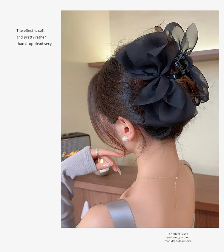 Mesh bow grab clip large hair clip shark clip headpiece on the back of the woman's head