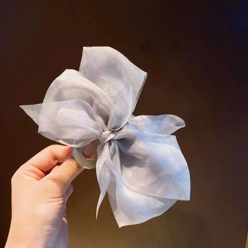 Mesh bow grab clip large hair clip shark clip headpiece on the back of the woman's head